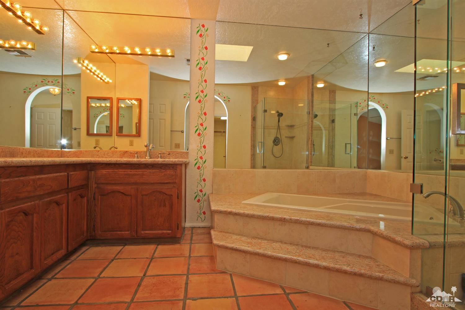 70400 Chappel Road Rancho Mirage, CA 92270 - Photo 30 of 49 a bathroom with a tub a sink and a mirror