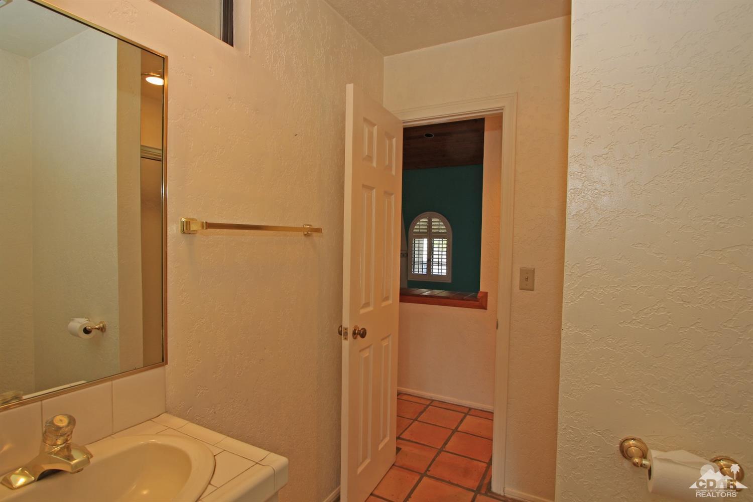 70400 Chappel Road Rancho Mirage, CA 92270 - Photo 34 of 49 a bathroom with a sink and a mirror