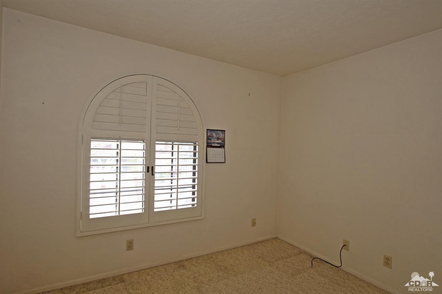 70400 Chappel Road Rancho Mirage, CA 92270 - Photo 37 of 49 an empty room with a window