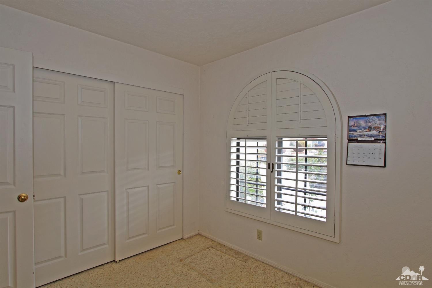 70400 Chappel Road Rancho Mirage, CA 92270 - Photo 38 of 49 an empty room with windows