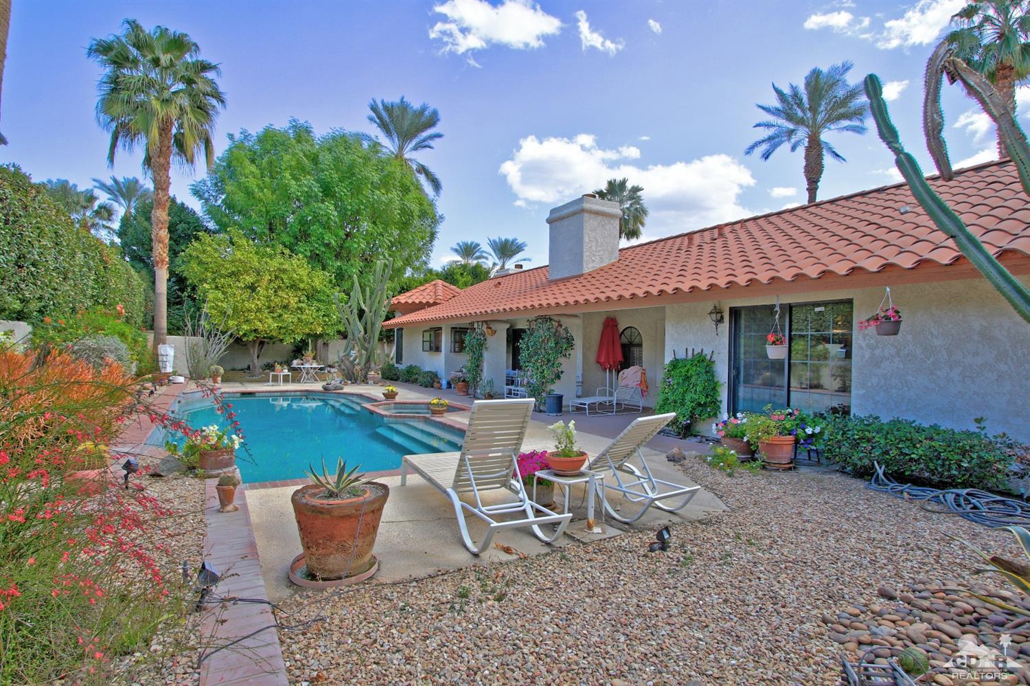 70400 Chappel Road Rancho Mirage, CA 92270 - Photo 42 of 49 a view of a patio with table and chairs potted plants