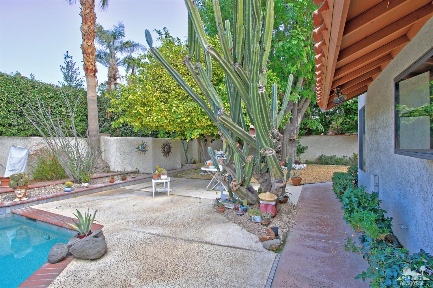 70400 Chappel Road Rancho Mirage, CA 92270 - Photo 44 of 49 a backyard of a house with outdoor seating