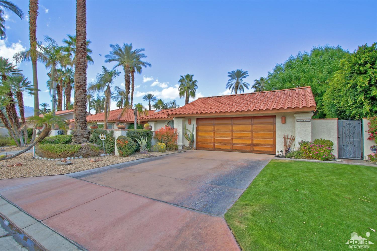 70400 Chappel Road Rancho Mirage, CA 92270 - Photo 49 of 49 a front view of a house with a yard and garage