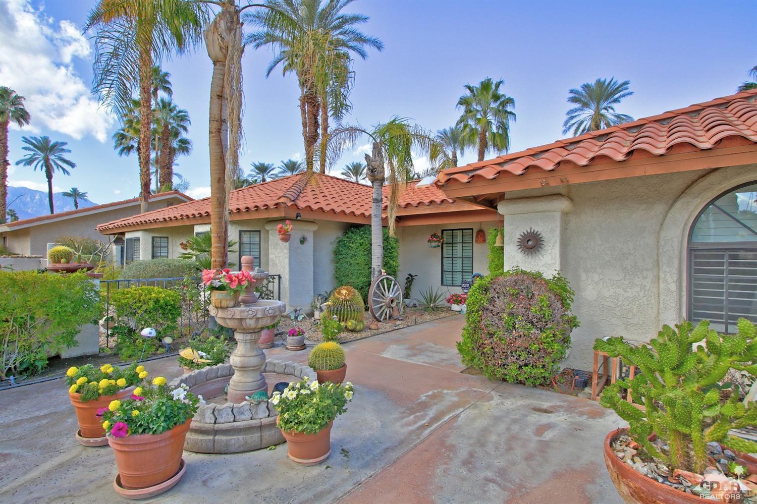 70400 Chappel Road Rancho Mirage, CA 92270 - Photo 6 of 49 a front view of a house with a garden