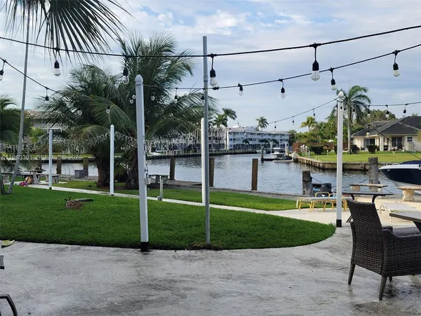 a view of a chair and tables in the patio