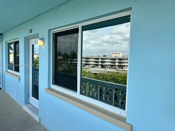 a view of a large window with a balcony view