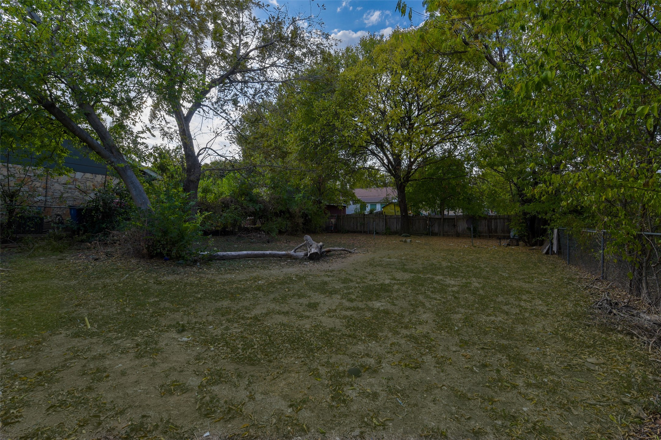 7306 Bethune Avenue Austin, TX 78752 - Photo 5 of 5 A spacious yard provides ample room for outdoor recreation and potential landscaping.