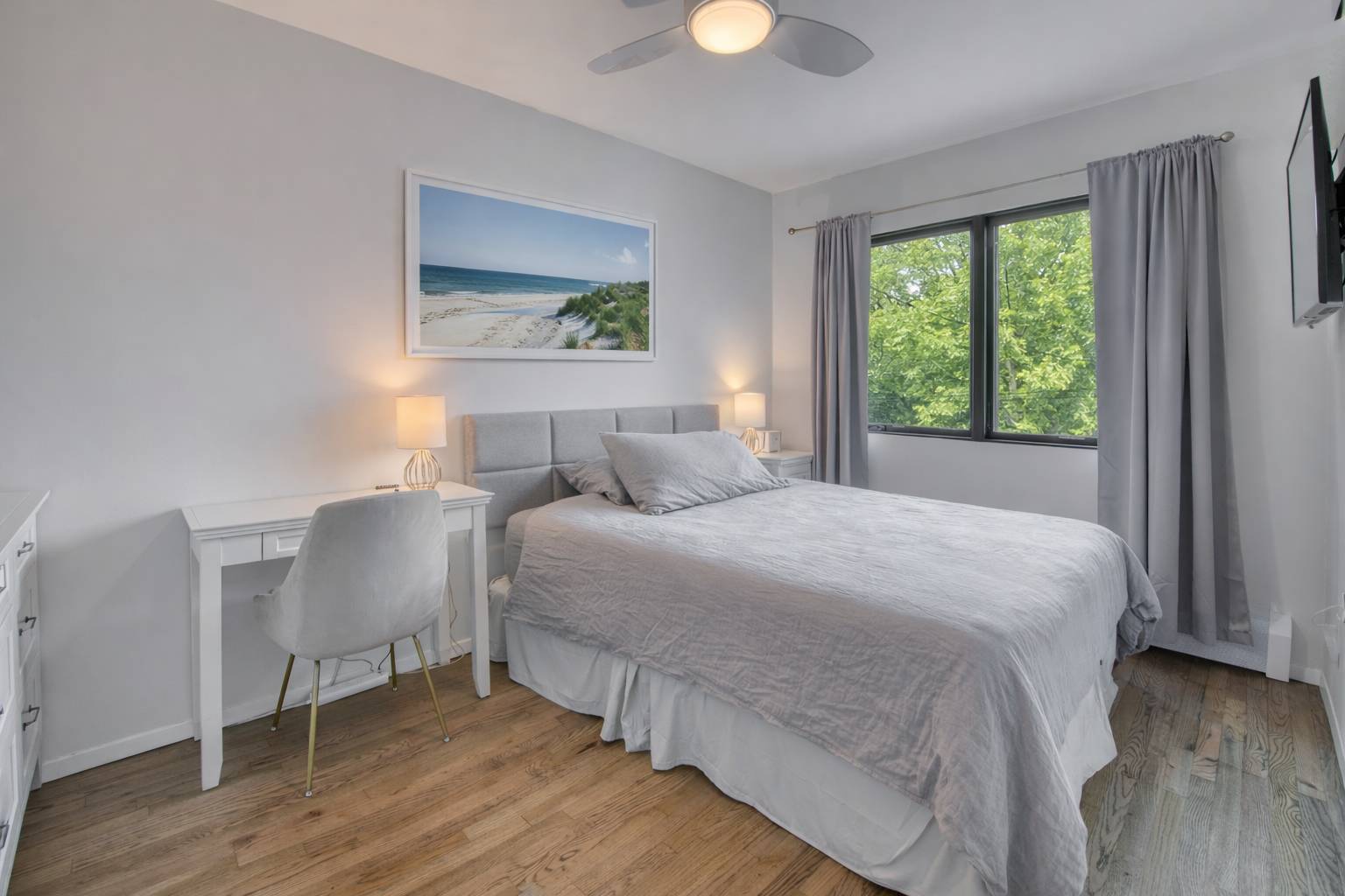 42 Whooping Hollow Road East Hampton, NY 11937 - Photo 18 of 21 a bedroom with a bed and a painting on the wall
