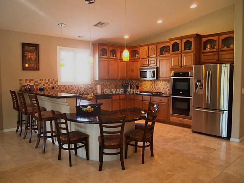 6811 Rose River Falls Street Las Vegas, NV 89131 - Photo 3 of 35 Property Photo. Built-in breakfast bar