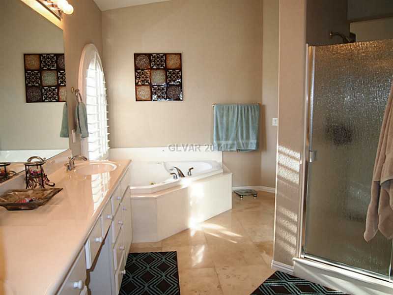 6811 Rose River Falls Street Las Vegas, NV 89131 - Photo 6 of 35 Property Photo. Duel vanity, jetted tub, rain glass shower