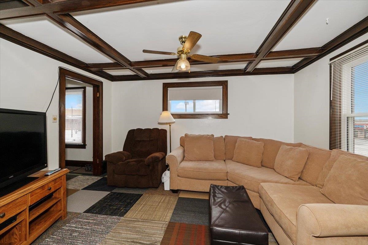 3729 East 2nd Street Superior, WI 54880 - Photo 7 of 20 Living area with ceiling fan, plenty of natural light, coffered ceiling, and beam ceiling