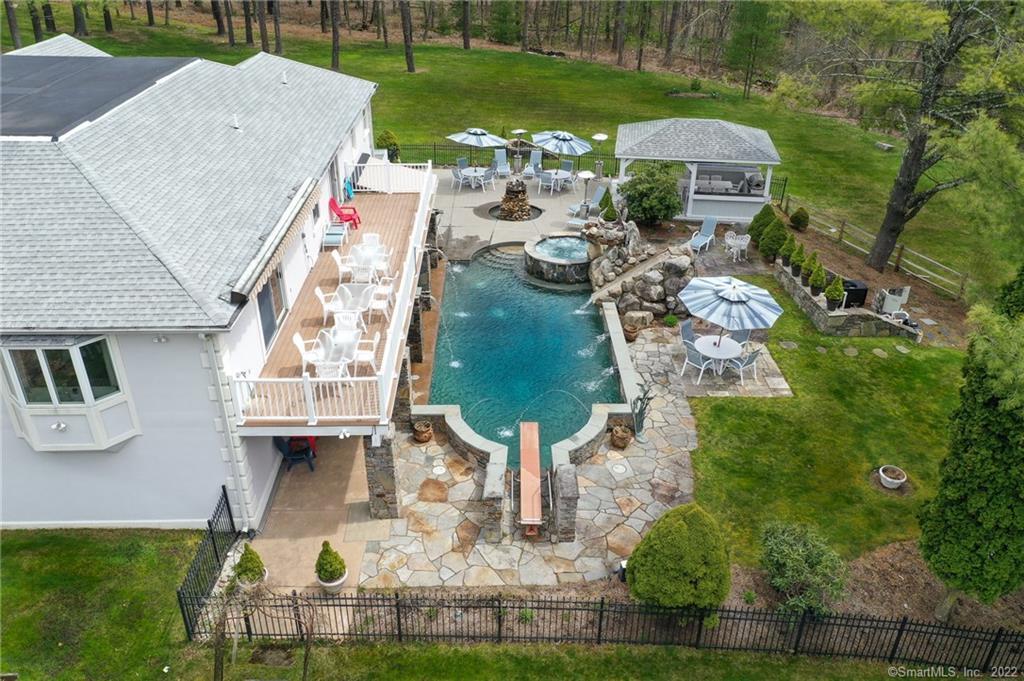 Aerial View of Award Winning 53X19 Pool and Hot Tub with Olympic Diving Board and 9 1/2 Feet deep, Gazebo and Outside Wet Bar, Cascading Water Show and Lights.