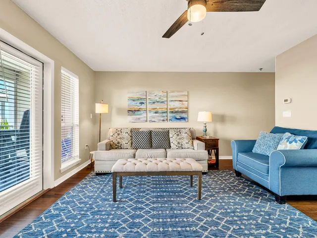 a living room with furniture and a rug
