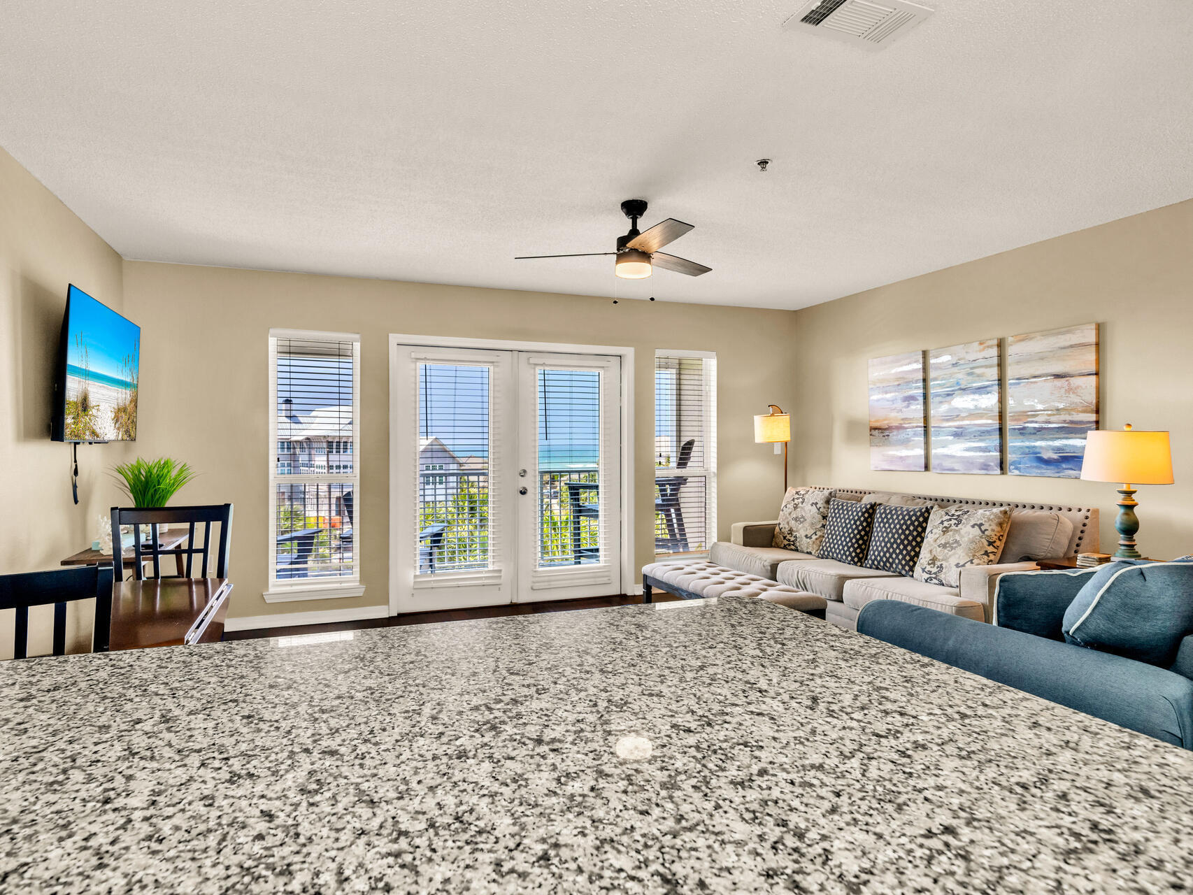 144 Spires Lane, Unit 410 Santa Rosa Beach, FL 32459 - Photo 20 of 33 a living room with furniture and large windows