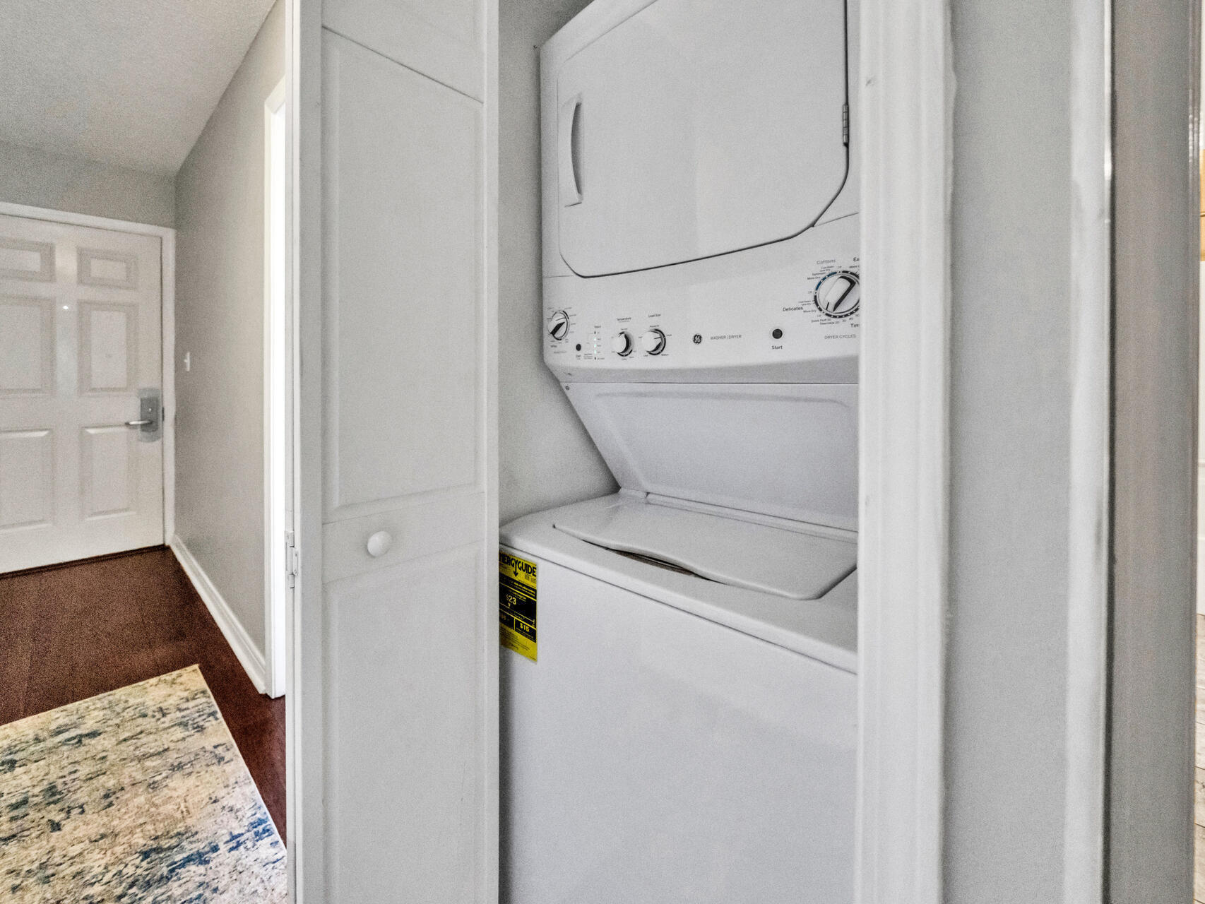144 Spires Lane, Unit 410 Santa Rosa Beach, FL 32459 - Photo 21 of 33 a view of a hallway with washer and dryer