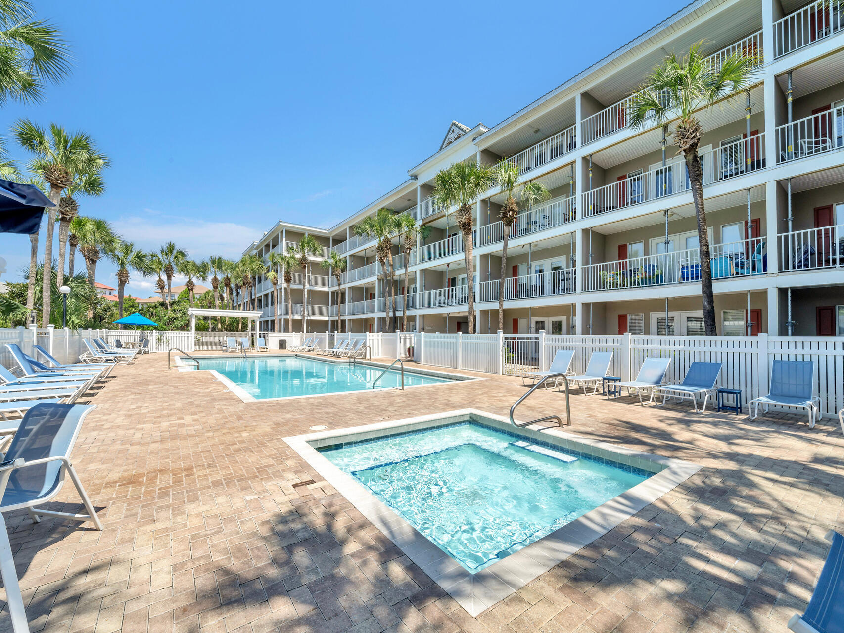 144 Spires Lane, Unit 410 Santa Rosa Beach, FL 32459 - Photo 32 of 33 a view of a swimming pool with a lounge chairs