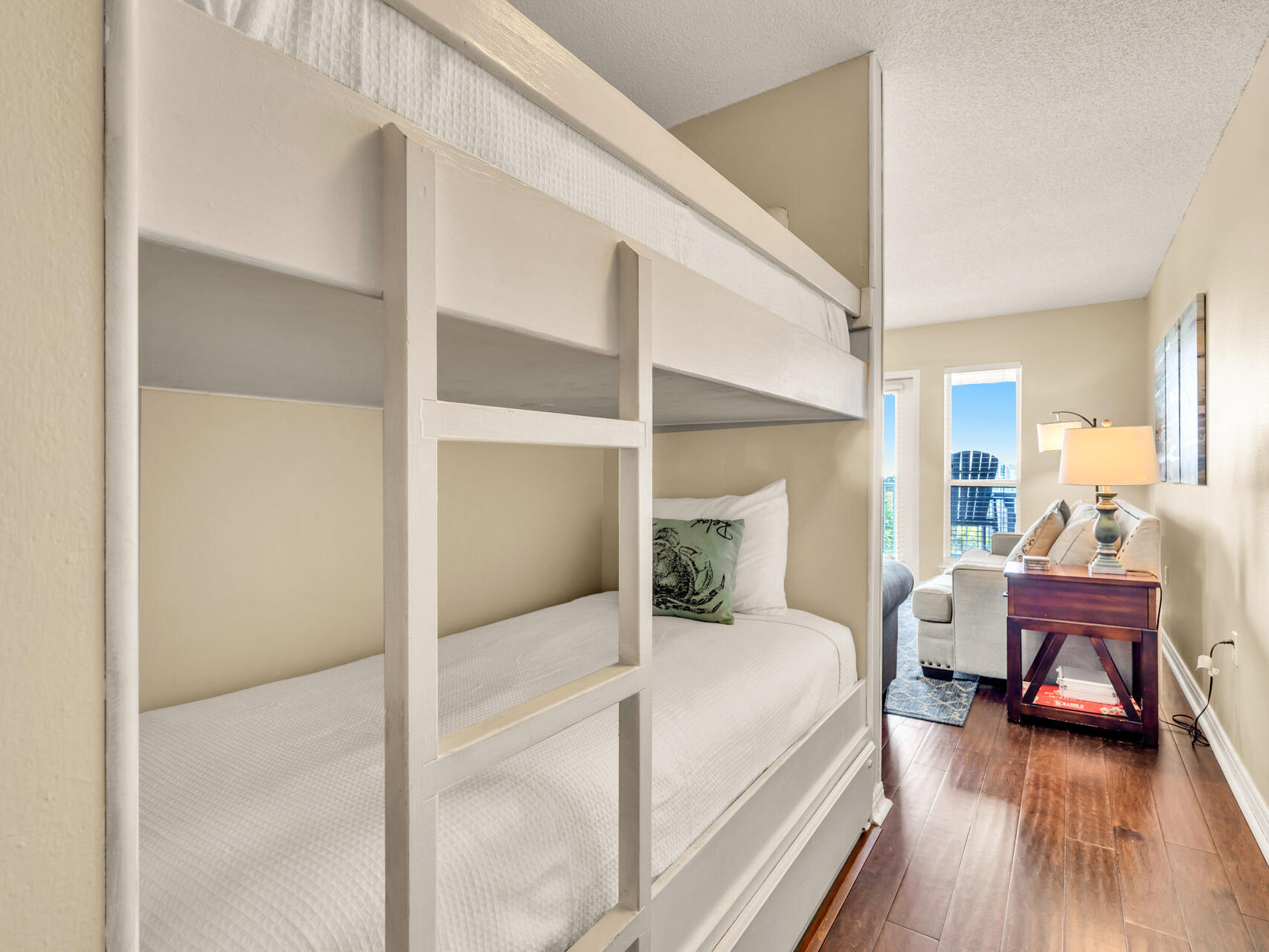 144 Spires Lane, Unit 410 Santa Rosa Beach, FL 32459 - Photo 5 of 33 a large bedroom with a bed and wooden floor