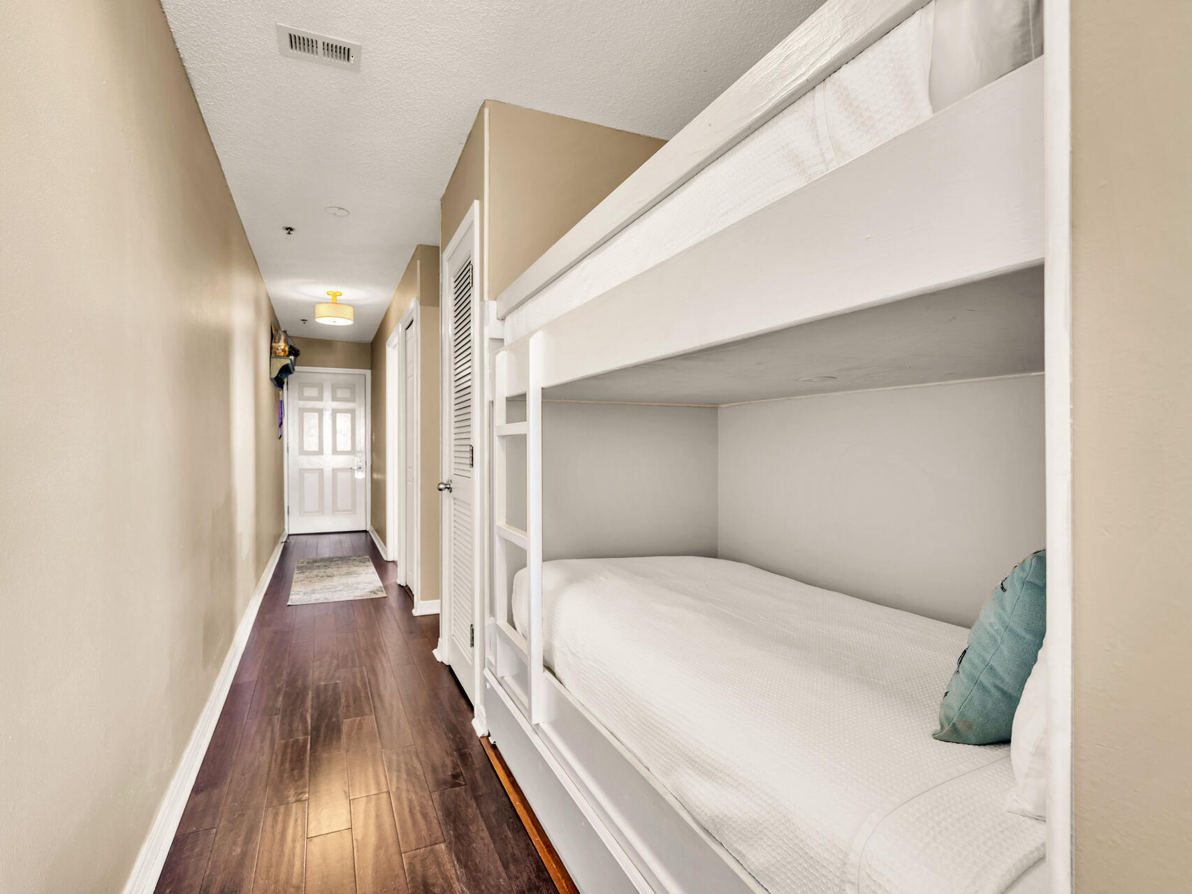 144 Spires Lane, Unit 410 Santa Rosa Beach, FL 32459 - Photo 6 of 33 a view of a hallway with wooden floor