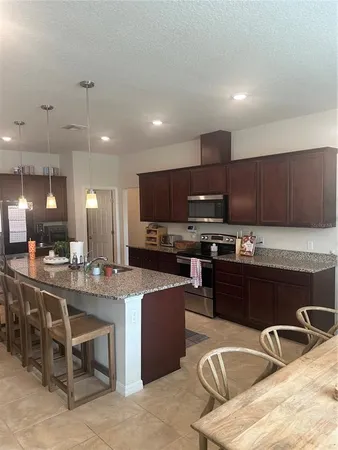 a kitchen with granite countertop lots of counter top space