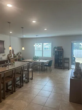 a group of chairs sitting in kitchen and dining room