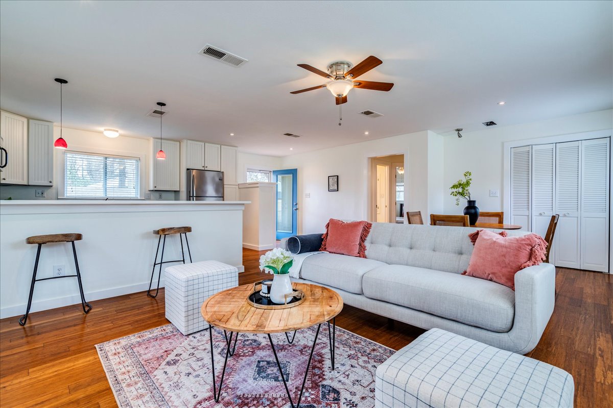 2505 Riddle Road Austin, TX 78748 - Photo 2 of 8 a living room with furniture kitchen view and a table