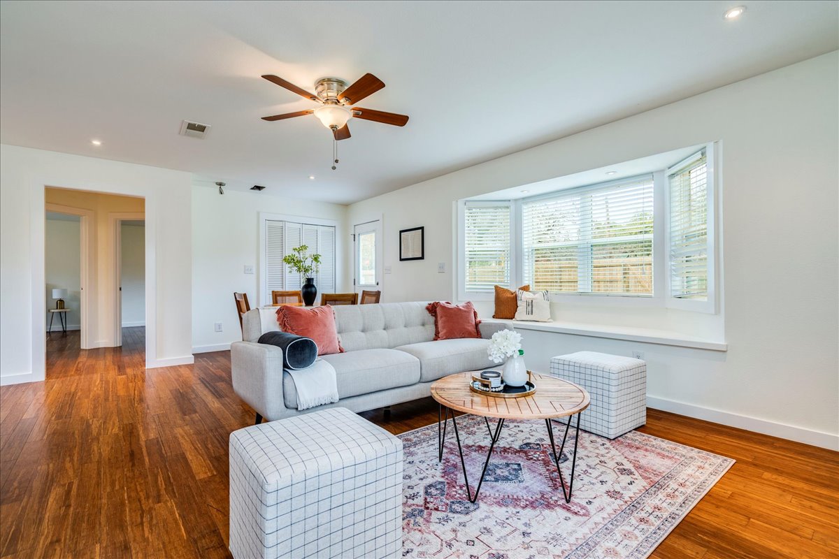 2505 Riddle Road Austin, TX 78748 - Photo 5 of 8 a living room with furniture and a wooden floor