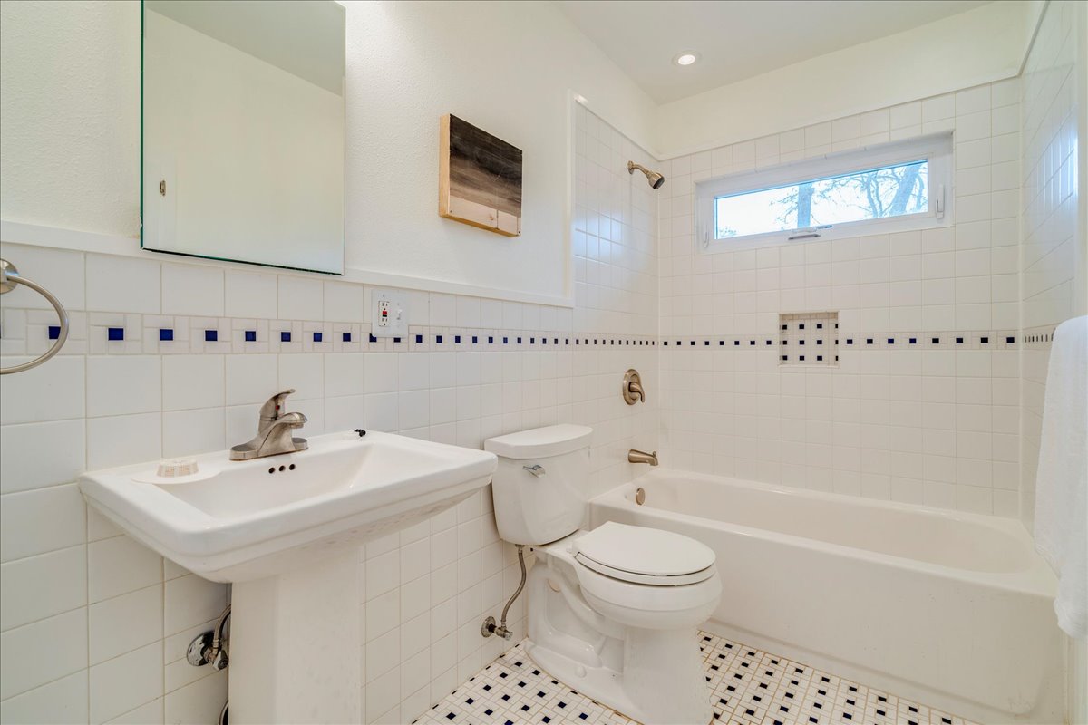 2505 Riddle Road Austin, TX 78748 - Photo 7 of 8 a bathroom with a sink a toilet and shower