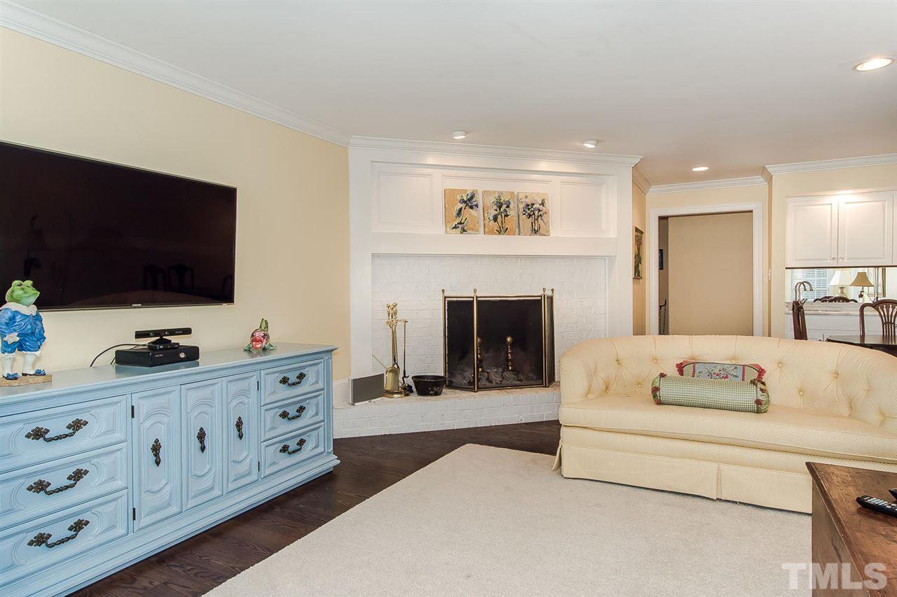 2342 Churchill Road Raleigh, NC 27608 - Photo 14 of 25 a living room with furniture and a flat screen tv