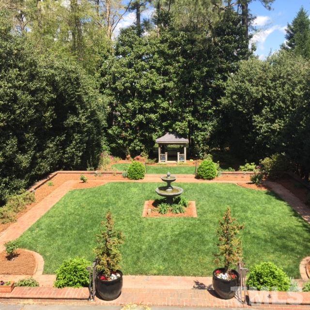 2342 Churchill Road Raleigh, NC 27608 - Photo 22 of 25 a backyard of a house with table and chairs