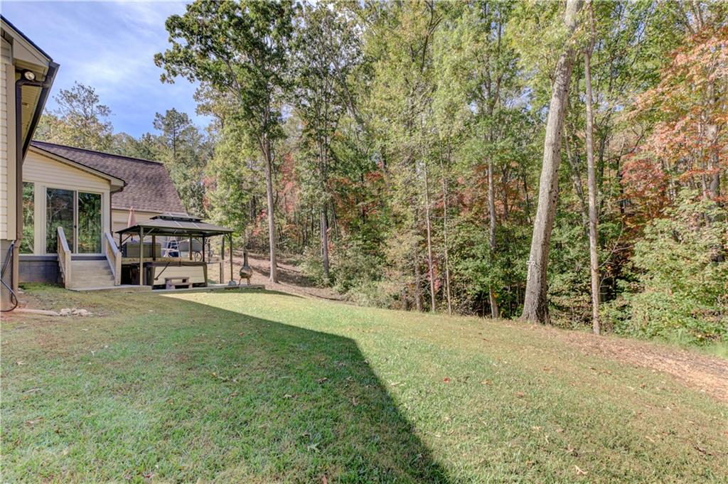 304 Garland Way Canton, GA 30115 - Photo 126 of 138 a front view of a house with a yard