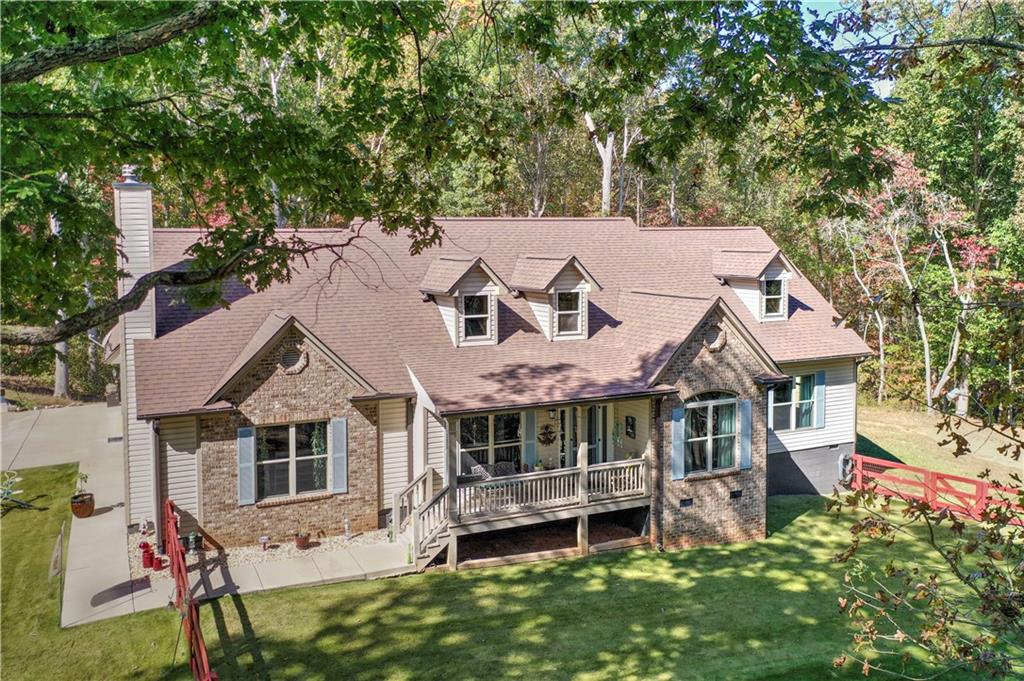 304 Garland Way Canton, GA 30115 - Photo 134 of 138 an aerial view of a house with a yard table and chairs