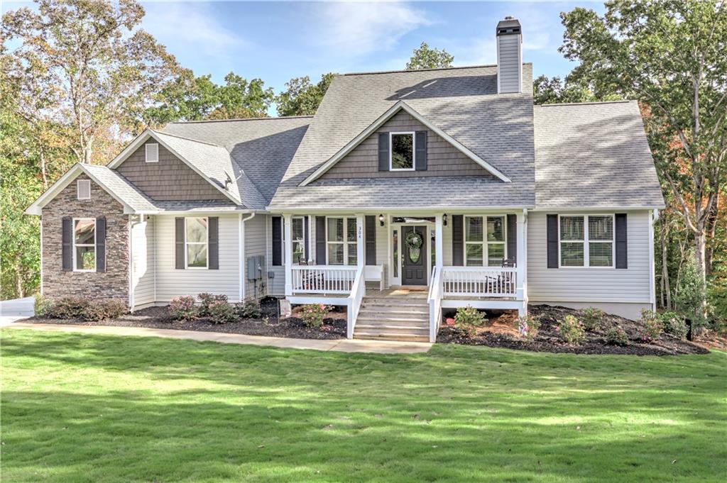 304 Garland Way Canton, GA 30115 - Photo 14 of 138 a front view of a house with a yard