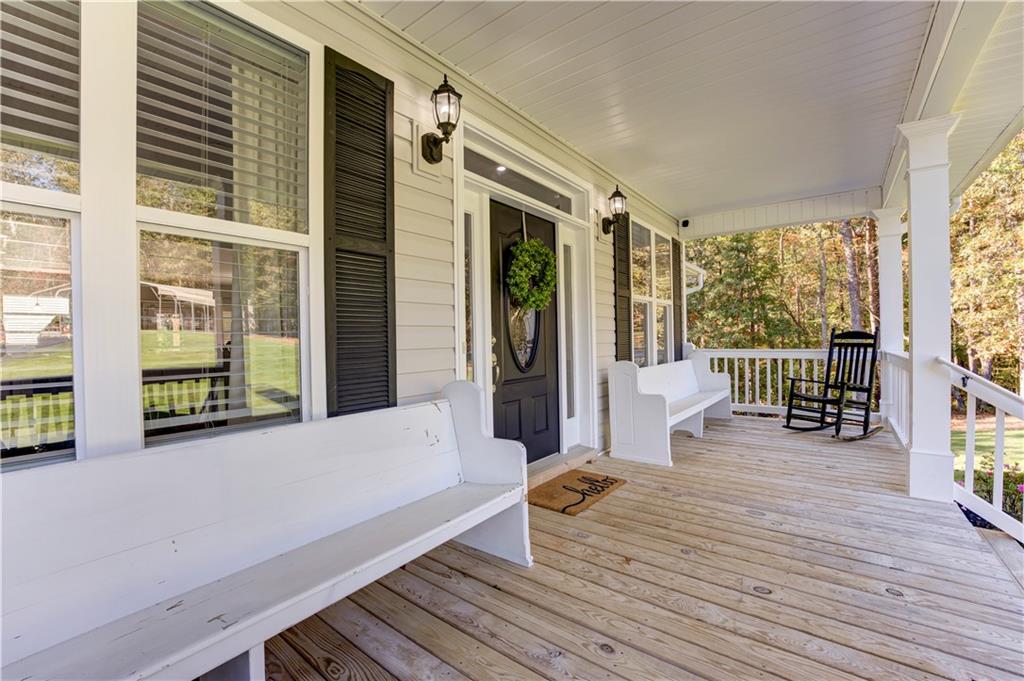 304 Garland Way Canton, GA 30115 - Photo 18 of 138 a balcony with couch and wooden floor