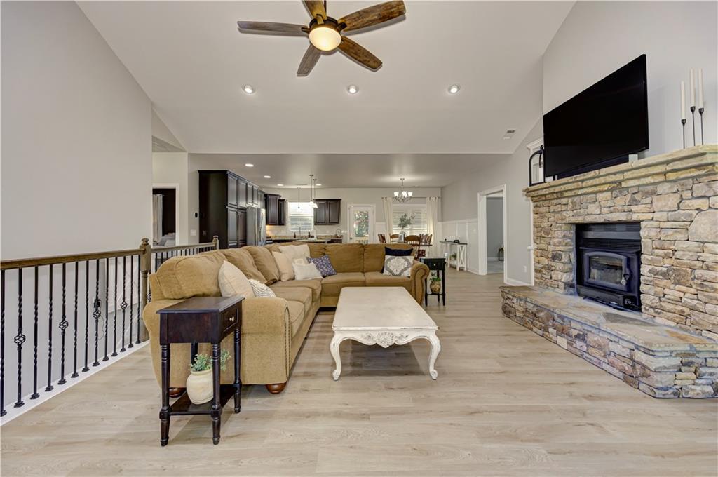 304 Garland Way Canton, GA 30115 - Photo 20 of 138 a living room with furniture and a fireplace