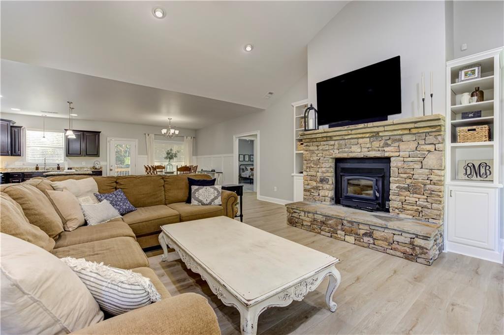 304 Garland Way Canton, GA 30115 - Photo 22 of 138 a living room with furniture and a fireplace