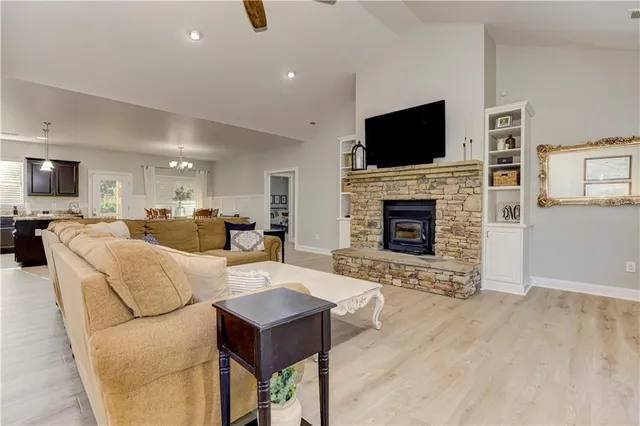 a bathroom with a toilet a sink a vanity and mirror