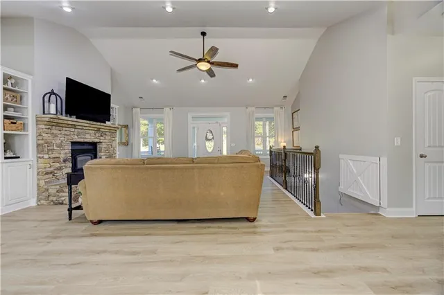 a view of a porch with wooden floor and iron stairs