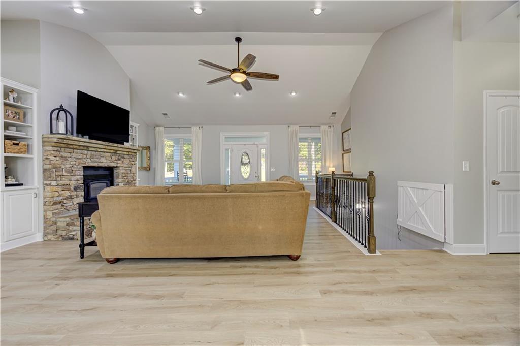 304 Garland Way Canton, GA 30115 - Photo 27 of 138 a living room with furniture and a fireplace