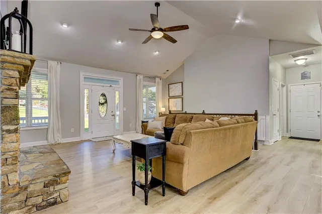 a view of a house with pool and a yard