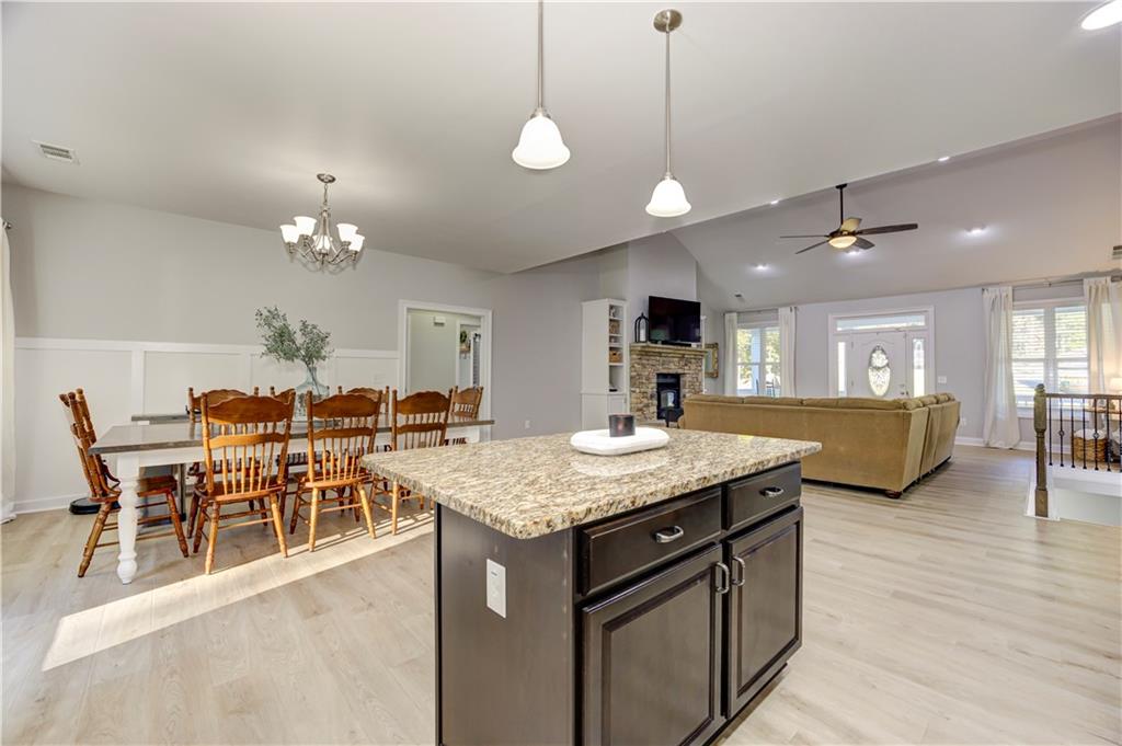 304 Garland Way Canton, GA 30115 - Photo 38 of 138 a view of a dining room with furniture and wooden floor