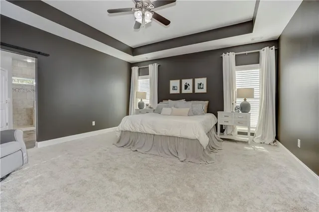 a bedroom with a bed and a book shelf