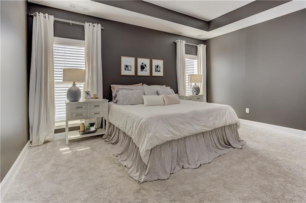 304 Garland Way Canton, GA 30115 - Photo 43 of 138 a bedroom with a bed and a large window