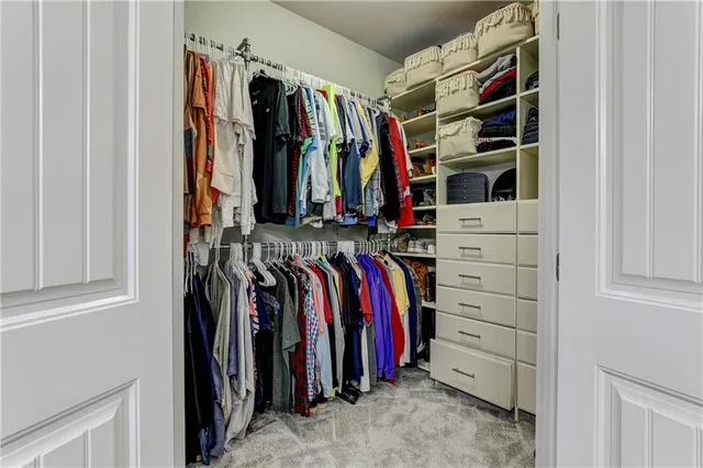 an aerial view of a house with a yard table and chairs