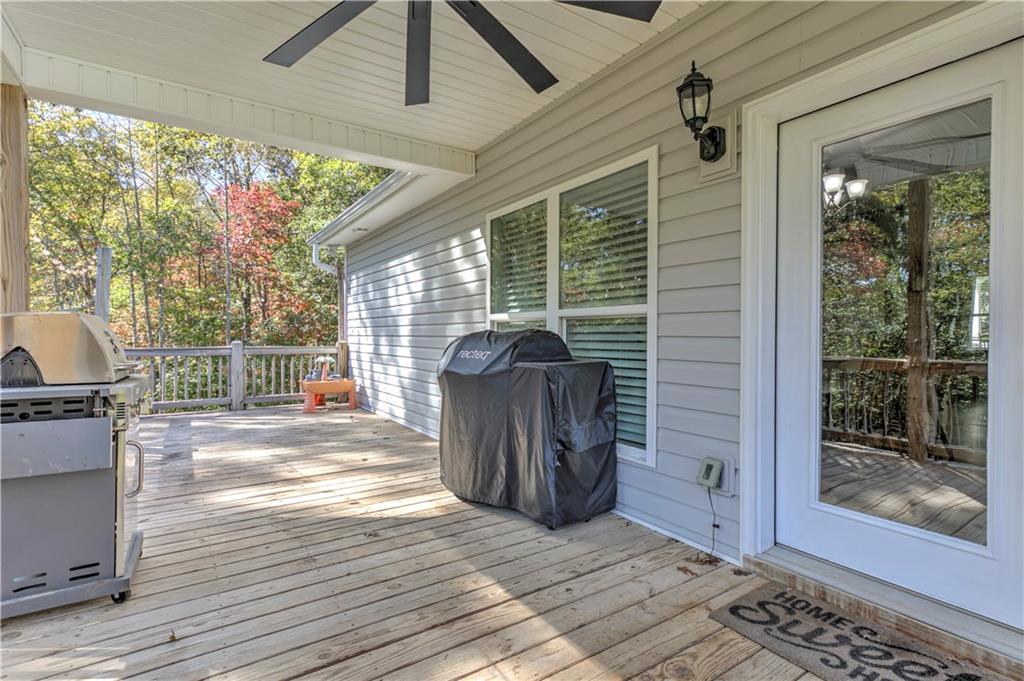 304 Garland Way Canton, GA 30115 - Photo 70 of 138 a view of a porch with wooden floor and iron stairs