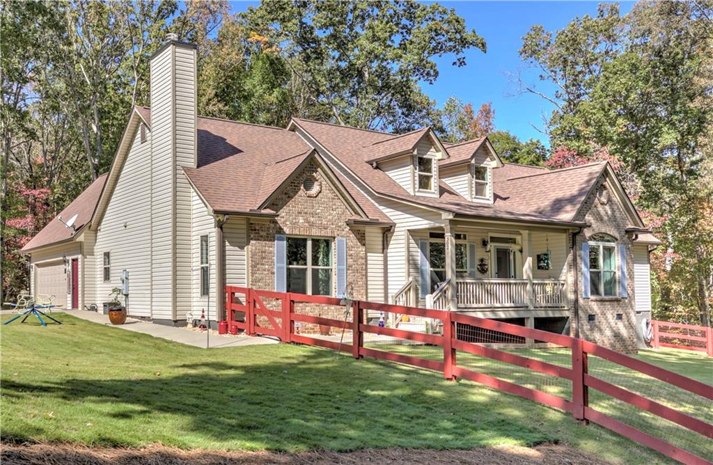 304 Garland Way Canton, GA 30115 - Photo 76 of 138 a front view of house with yard and green space