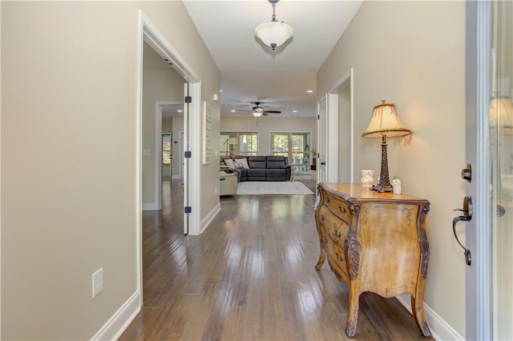 304 Garland Way Canton, GA 30115 - Photo 80 of 138 a view of a hallway with wooden floor windows and livingroom