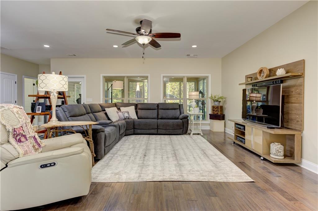 304 Garland Way Canton, GA 30115 - Photo 82 of 138 a living room with furniture and a flat screen tv