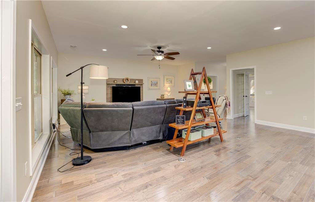 304 Garland Way Canton, GA 30115 - Photo 86 of 138 a living room with furniture and a flat screen tv