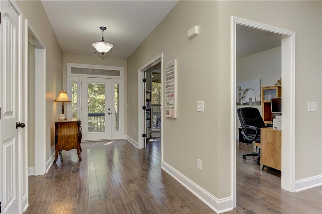 304 Garland Way Canton, GA 30115 - Photo 89 of 138 wooden floor in an empty room and a en suite bathroom with sink