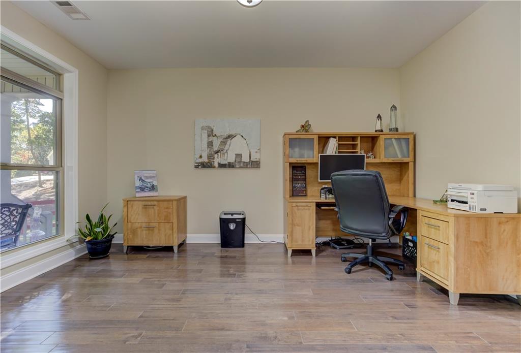 304 Garland Way Canton, GA 30115 - Photo 90 of 138 a view of a workspace with furniture and a window
